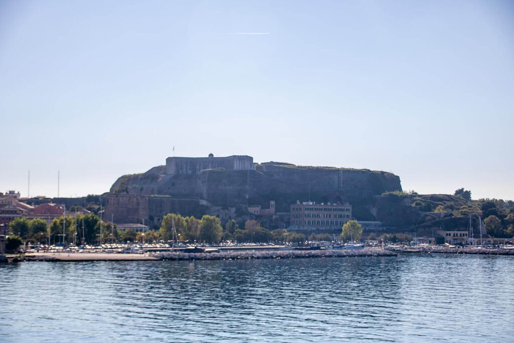 Panoramic view from the New Venetian Fortress in Corfu with ships in the harbor.
