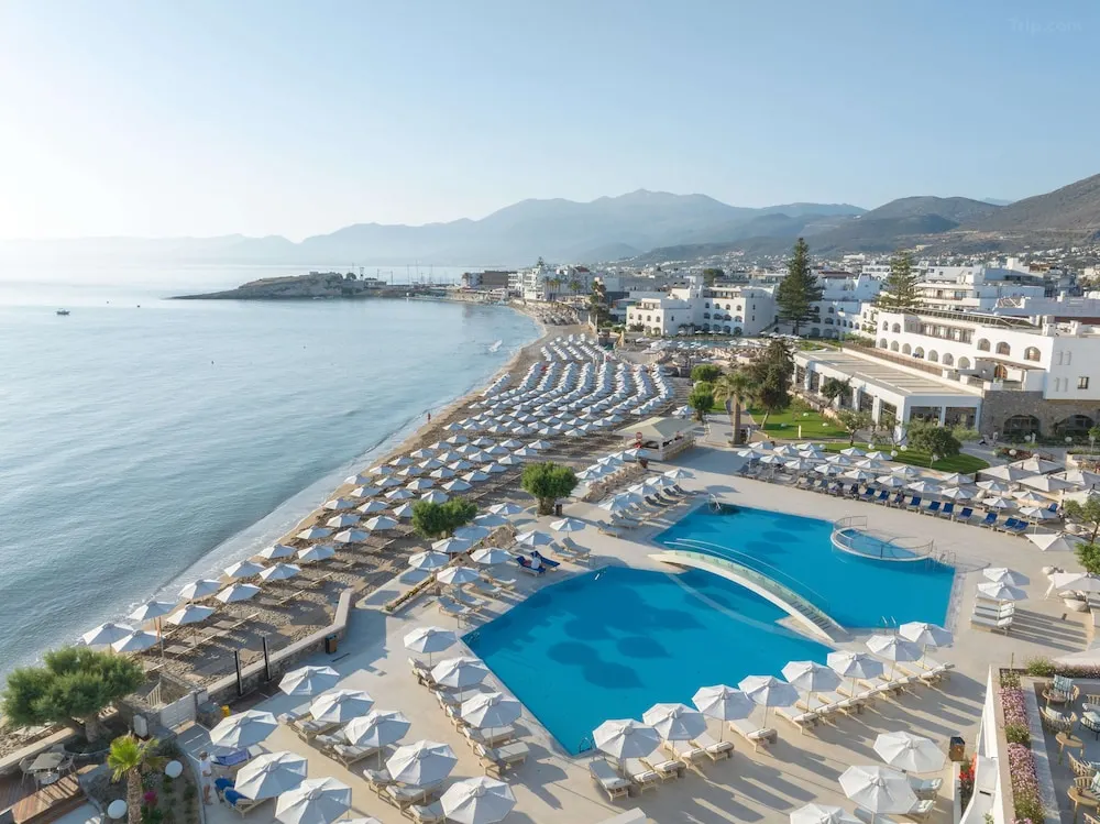 Seaside luxury at Crete Creta Maris Resort, featuring cascading infinity pools and private cabanas overlooking the Mediterranean coastline.