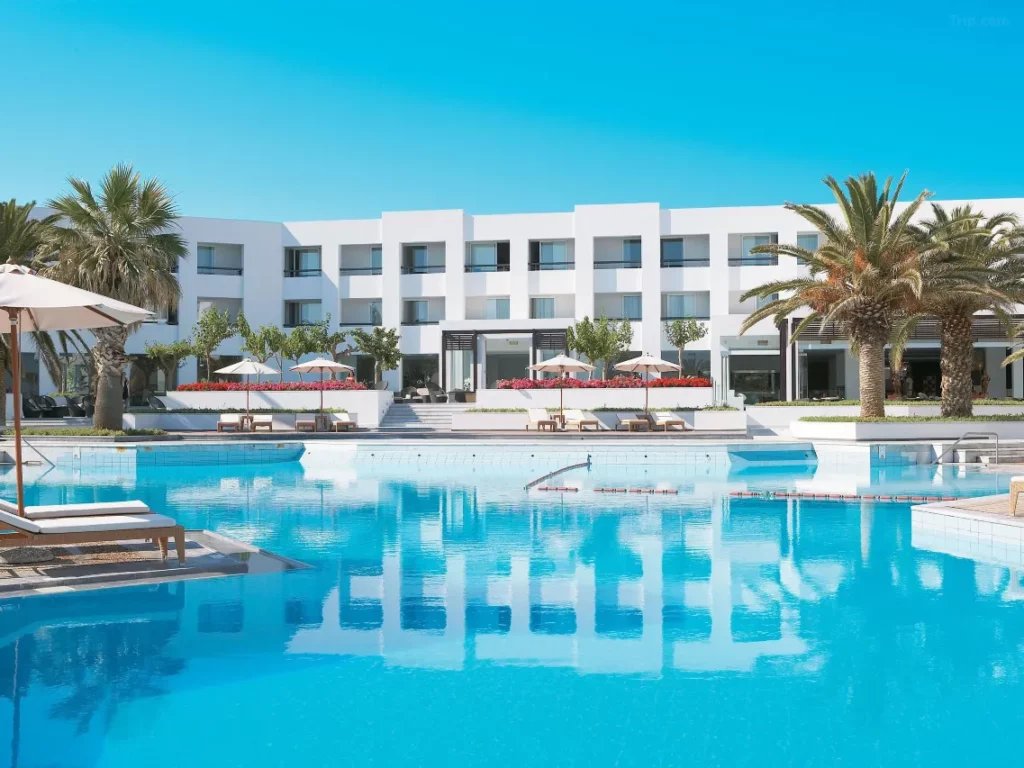 "Cliffside luxury at Crete’s Grecotel Creta Palace, featuring private terraces with panoramic Aegean Sea views and sunset cocktail service.